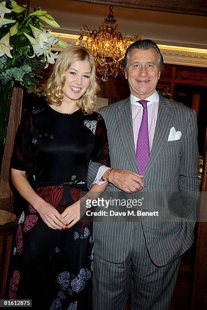 Actress Rosamund Pike and Arnaud Bamberger, MD of Cartier UK pose to launch the the Cartier Love Charity Bracelet in support of Action Against...