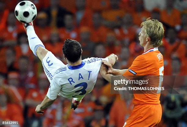 Romanian defender Razvan Rat fights for the ball with Dutch forward Dirk Kuyt during the Euro 2008 Championships Group C football match Netherlands...