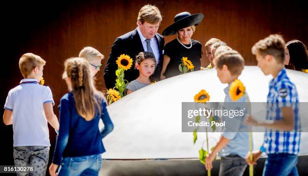 King Willem-Alexander of The Netherlands and Queen Maxima of The Netherlands attend the MH17 remembrance ceremony and the unveiling of the National...