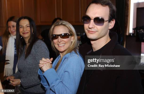 Laura Franklin in Dior Party 2 sunglasses and Jeff Vespa in Burberry 94115