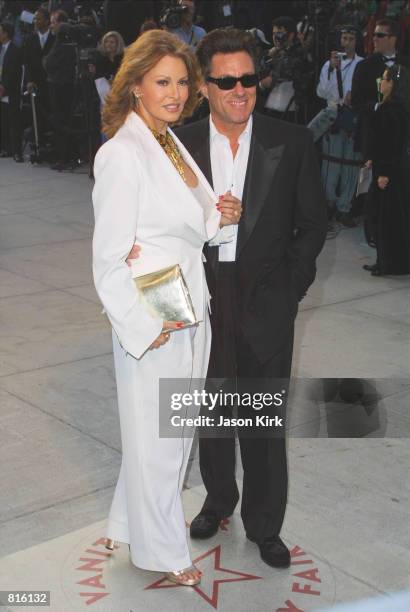 Actress Raquel Welch and Fiancee Richard Palmer arrive at the Vanity Fair post-Oscars party March 25, 2001 at Morton's restaurant in Beverly Hills.
