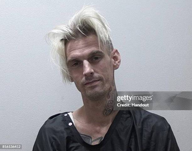 In this handout photo provided by the Habersham Co Sheriff Office, Singer Aaron Carter poses for his booking photo after being charged for marijuana...