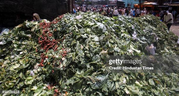 Garbage piles at old Dadar vegetable market stayed unmoved as hundreds of lower rung BMC staff went on strike demanding sixth pay commission...