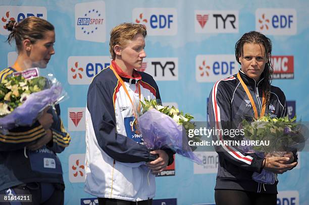 Italy's Elena Gemo, Spain's Nina Zhivanevskaya and Fance's Laure Manaudou pose on the podium the 50m women's backstroke final of the Paris Swimming...