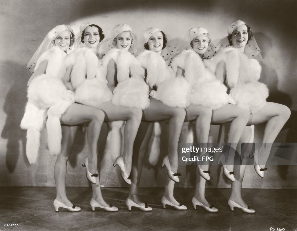 A group of chorus girls in costumes of white fur, circa 1935. News ...