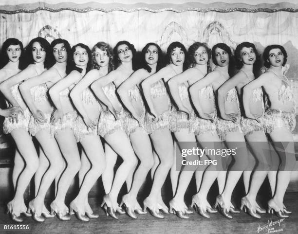 Group of chorus girls in sparkly costumes, circa 1925.
