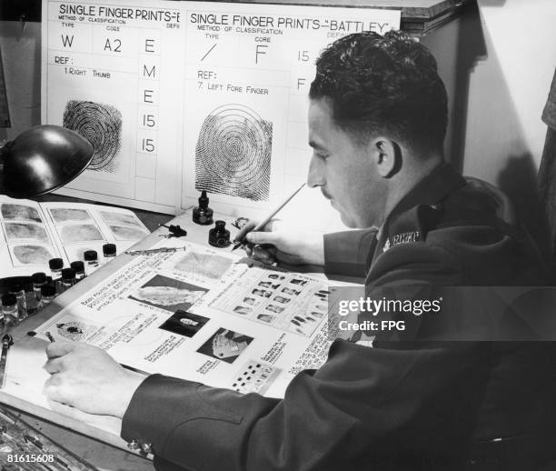 Member of the Royal Canadian Mounted Police prepares a report identifying a corpse discovered in the Ottawa River as that of Private Norman Lebrum of...