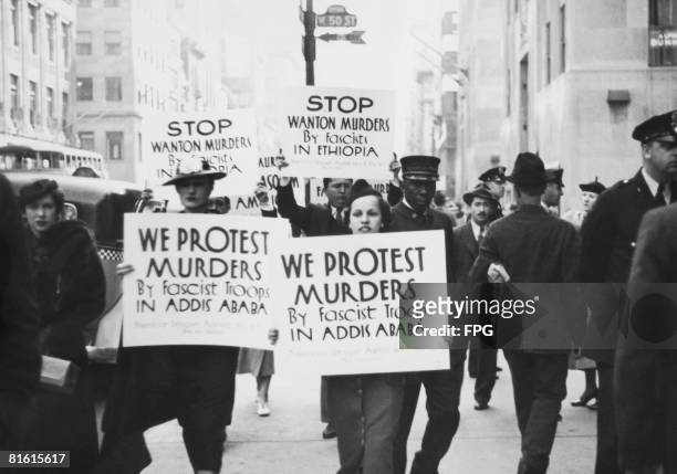Members of the American League Against War and Fascism picket the Italian Consulate on Fifth Avenue, New York, protesting against the brutality of...