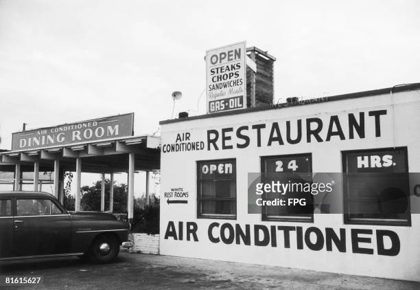 Sign outside an American restaurant points to the 'White Rest Rooms', in a clear indication of racial segregation, circa 1960.