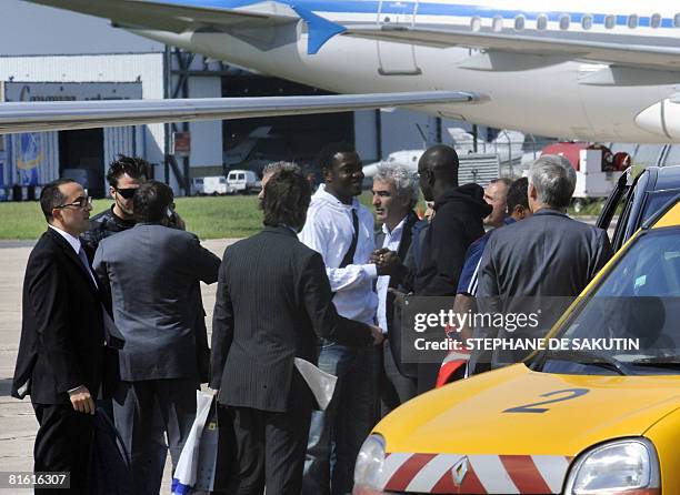 France football team's defender Lilian Thuram , head coach Raymond Domenech and goalkeeper substitute Steve Mandanda arrive at Le Bourget airport,...