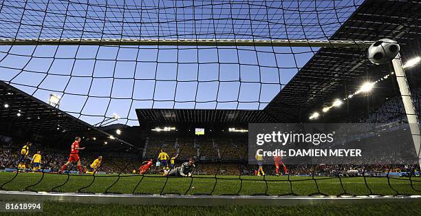 Swedish goalkeeper Andreas Isaksson eyes the ball in the net after the goal of Russianforward Roman Pavlyuchenko during the Euro 2008 Championships...