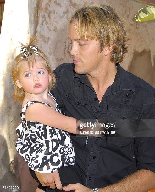 Dannielynn Smith and Larry Birkhead arrive at the Launch celebration party for The Simpson's Ride at Universal Studios Hollywood on May 17, 2008 in...