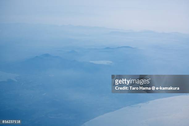 lake usori and mt. osorezan, sacred place in aomori prefecture daytime aerial view from airplane - mutsu stock pictures, royalty-free photos & images