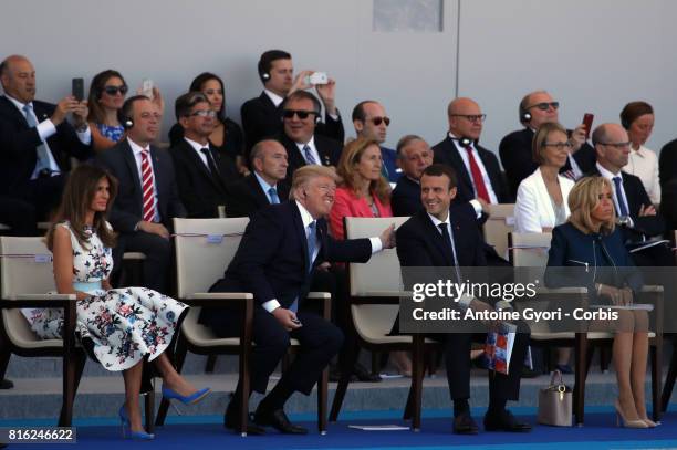 President Donald Trump and his wife Melania Trump, French President Emmanuel Macron and his wife Brigitte Trogneux during the traditional Bastille...