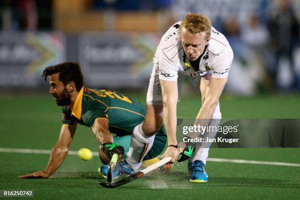 Amaury Keusters of Belgium shoots as Jethro Eustice of South Africa attempts to block during the Group B match between South Africa and Belgium on...