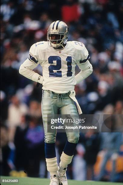 Defensive back Deion Sanders of the Dallas Cowboys waits between plays against the Philadelphia Eagles at Texas Stadium in the 1995 NFC Divisional...