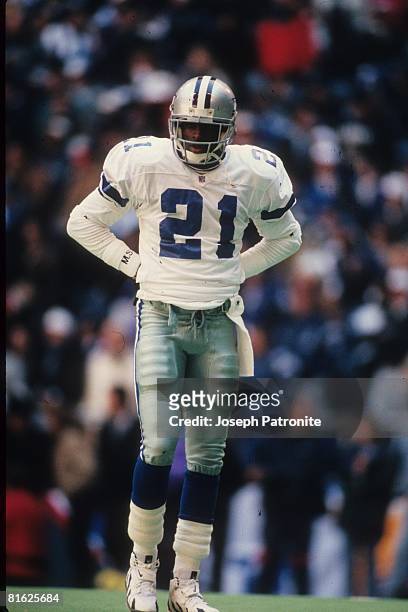 Defensive back Deion Sanders of the Dallas Cowboys waits between plays against the Philadelphia Eagles at Texas Stadium in the 1995 NFC Divisional...