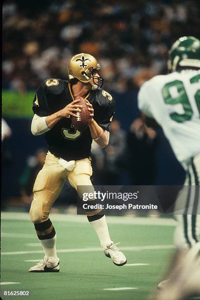 Quarterback Bobby Hebert of the New Orleans Saints sets up to pass against the Philadelphia Eagles at the Superdome in the 1992 NFC Wild Card Game on...