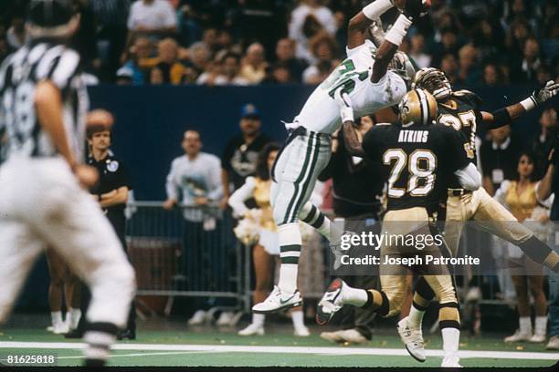 Wide receiver Fred Barnett of the Philadelphia Eagles catches a touchdown pass against the New Orleans Saints at the Superdome in the 1992 NFC Wild...