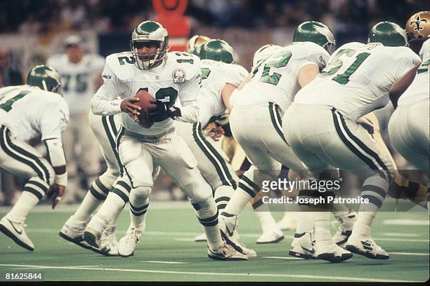 Quarterback Randall Cunningham of the Philadelphia Eagles drops back to pass against the New Orleans Saints at the Superdome in the 1992 NFC Wild...