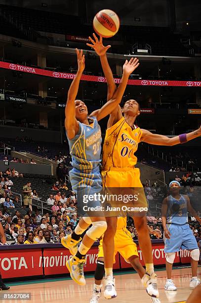 Murriel Page of the Los Angeles Sparks reaches for the ball during the game against Armintie Price of the Chicago Sky on June 18, 2008 at Staples...