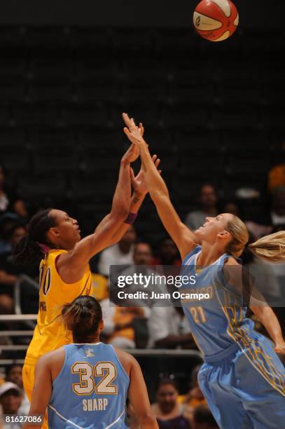 Murriel Page of the Los Angeles Sparks reaches for the ball against Brooke Wyckoff of the Chicago Sky during the game on June 18, 2008 at Staples...