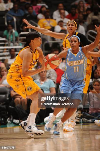 Kamela Gissendanner of the Los Angeles Sparks passes the ball during the game against Jia Perkins of the Chicago Sky on June 18, 2008 at Staples...