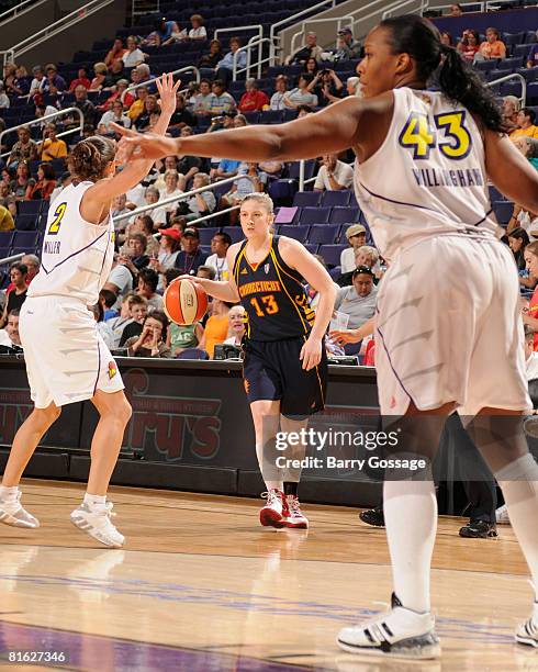 Lindsay Whalen of the Connecticut Sun dribbles against Kelly Miller of the Phoenix Mercury at U.S. Airways Center June 18, 2008 in Phoenix, Arizona....