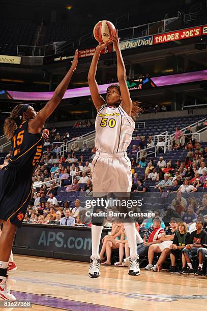 Tangela Smith of the Phoenix Mercury shoots against Asjha Jones of the Connecticut Sun at U.S. Airways Center June 18, 2008 in Phoenix, Arizona. NOTE...