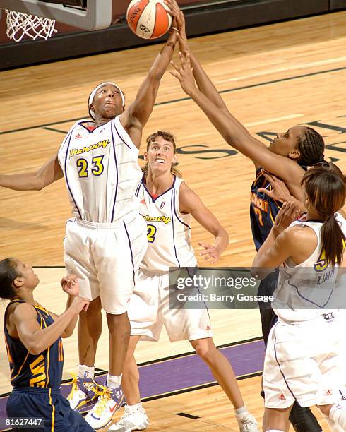 Cappie Pondexter of the Phoenix Mercury graps a rebound against Sandrine Gruda of the Connecticut Sun at U.S. Airways Center June 18, 2008 in...