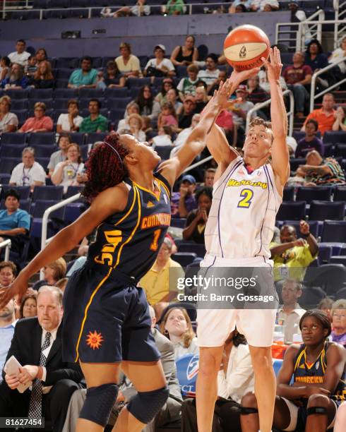 Kelly Miller of the Phoenix Mercury shoots against Amber Holt of the Connecticut Sun at U.S. Airways Center June 18, 2008 in Phoenix, Arizona. NOTE...