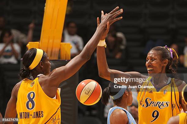 Lisa Leslie of the Los Angeles Sparks high-fives DeLisha Milton-Jones of the Los Angeles Sparks during the game against the Chicago Sky on June 18,...