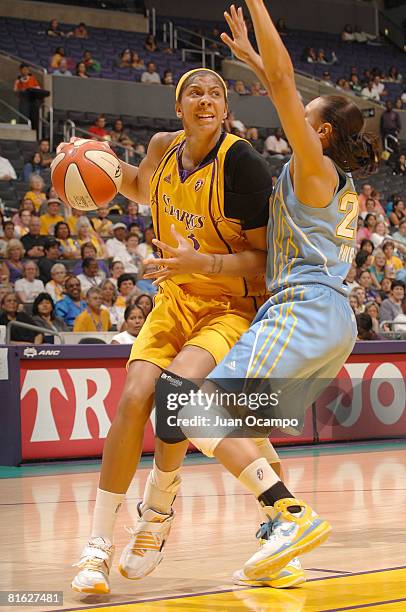 Candace Parker of the Los Angeles Sparks drives the ball during the game against Armintie Price of the Chicago Sky on June 18, 2008 at Staples Center...