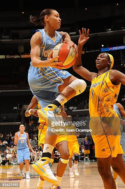 DeLisha Milton-Jones of the Los Angeles Sparks defends as Armintie Price of the Chicago Sky goes up for a shot during game on June 18, 2008 at...