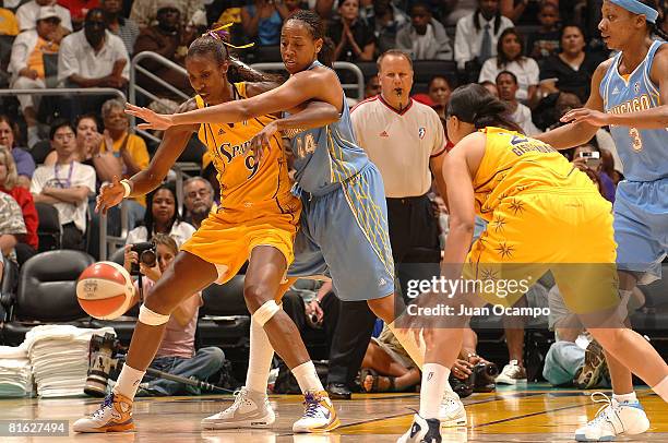 Lisa Leslie of the Los Angeles Sparks defends the ball as Chasity Melvin of the Chicago Sky reaches in during the game on June 18, 2008 at Staples...