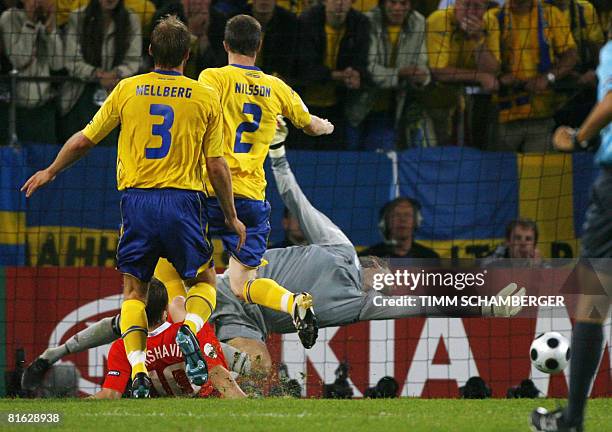 Swedish goalkeeper Andreas Isaksson fails to save a goal shot by Russian forward Andrei Arshavin during the Euro 2008 Championships Group D football...