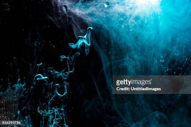 blue paint in water - underwater texture stock pictures, royalty-free photos & images