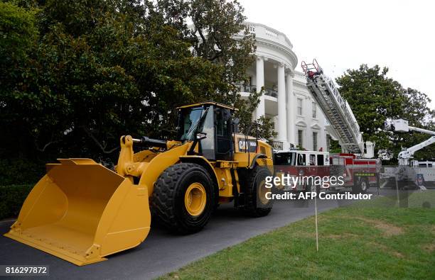 Made products from all 50 states including an iconic Yellow Iron from Caterpillar Inc. Are on display on the South Lawn of the White House as part of...