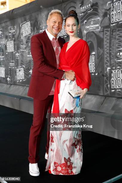 Uwe Fahrenkrog-Petersen and his partner Christin Dechant attend the 'Atomic Blonde' - World Premiere at Stage Theater on July 17, 2017 in Berlin,...