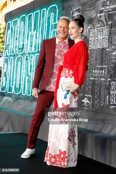 Uwe Fahrenkrog-Petersen and his partner Christin Dechant attend the 'Atomic Blonde' - World Premiere at Stage Theater on July 17, 2017 in Berlin,...