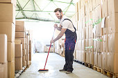 Man sweeping the warehouse floor