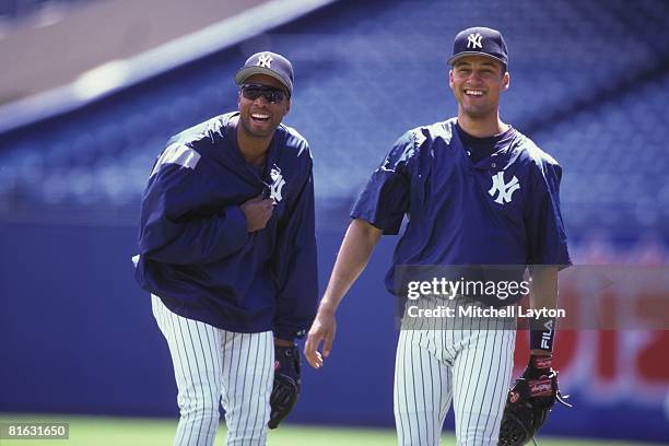 Bernie Williams and Derek Jeter of the New York Yankees before a baseball game on June 1, 1997 at Yankee Stadium in New York, New York.