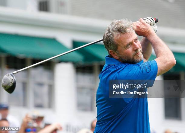 Actor Aidan Quinn follows the flight of his tee shot during the Travelers Championship Pro-Ams at the TPC River Highlands on June 18, 2008 in...