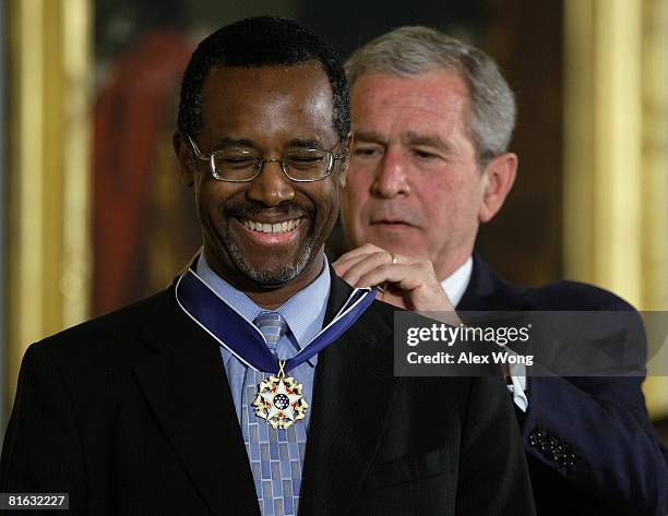 President George W. Bush presents a Presidential Medal of Freedom to Benjamin S. Carson, Sr. M.D , for his work withneurological disorders during an...