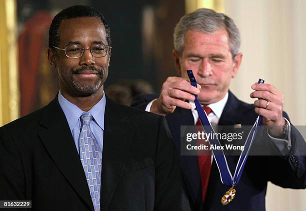 President George W. Bush presents a Presidential Medal of Freedom to Benjamin S. Carson, Sr. M.D , during an East Room ceremony June 19, 2008 at the...