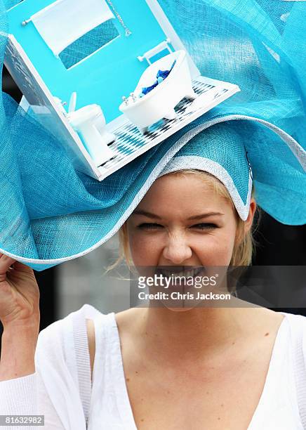 Woman wears an elaborate hat, styled on a theme of a bathroom interior, during Ladies Day at Royal Ascot racecourse on June 19, 2008 in Ascot,...