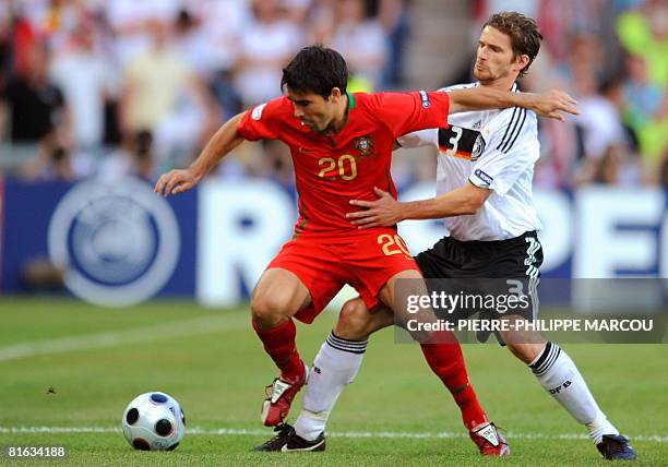 Portuguese midfielder Deco and German defender Arne Friedrich fight for the ball during the Euro 2008 Championships quarter-final football match...