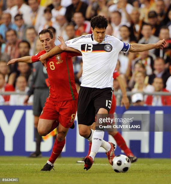 German midfielder Michael Ballack vies with Portuguese midfielder Petit during the Euro 2008 Championships quarter-final match Portugal vs. Germany...