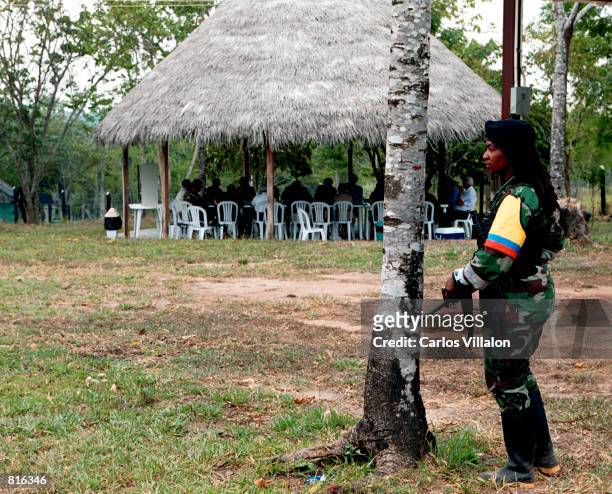 Guerrilla guards an FARC meeting February 28, 2001 in Villa Nueva Colombia, Los Pozos, Colombia. The FARC , the country's largest rebel group, has...