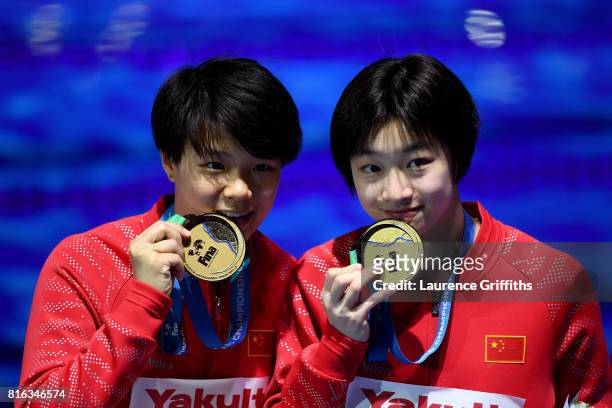 Gold medalists Yani Chang and Tingmao Shi of China pose with the medals won during the Women's Diving 3M Synchro Springboard final on day four of the...